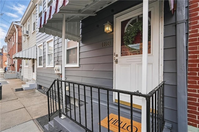 doorway to property featuring a porch