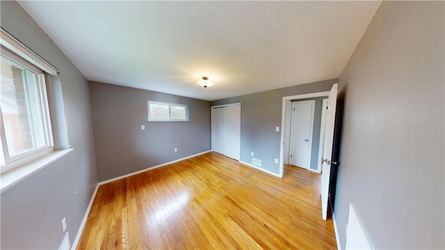 393 Eagle Mill Rd, Connoquenessing Twp, PA 16001 - unfurnished bedroom featuring light wood-type flooring, baseboards, and a closet