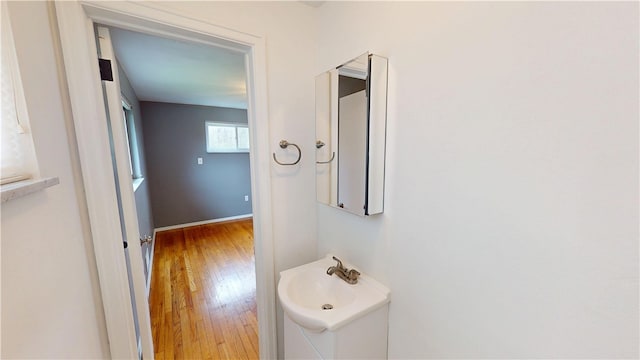393 Eagle Mill Rd, Connoquenessing Twp, PA 16001 - bathroom featuring wood finished floors, vanity, and baseboards