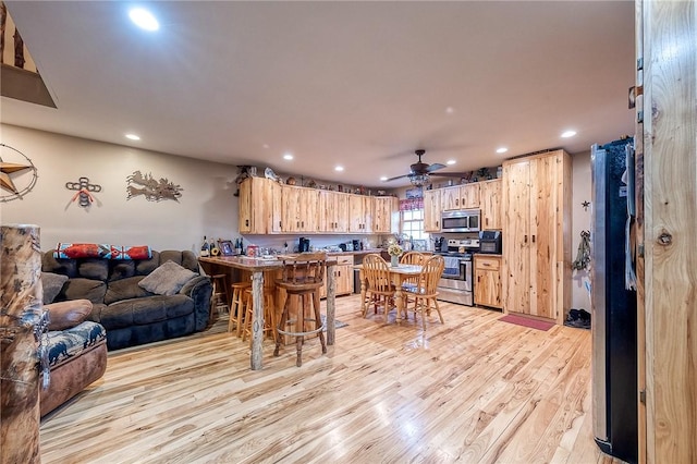 2072 Washington, Washington Twp Wml, PA 15613 - kitchen with light wood-type flooring, stainless steel appliances, light brown cabinets, and recessed lighting