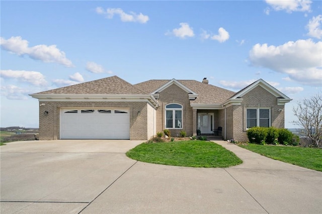 ranch-style home featuring a front lawn, driveway, and brick siding