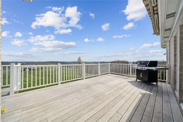 wooden deck featuring grilling area