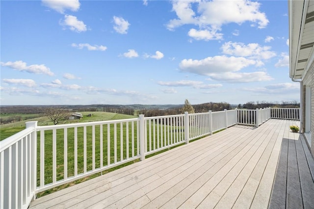 wooden terrace with a yard