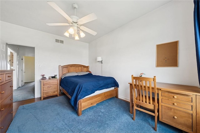 bedroom featuring carpet, visible vents, baseboards, and ceiling fan