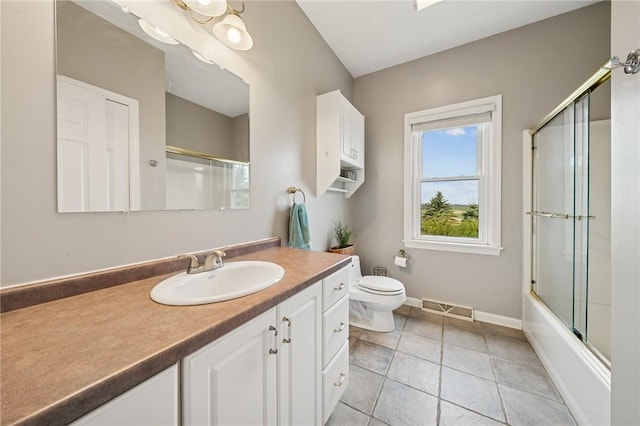 bathroom featuring toilet, baseboards, visible vents, tile patterned flooring, and vanity