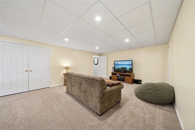 living area featuring recessed lighting, carpet, and baseboards