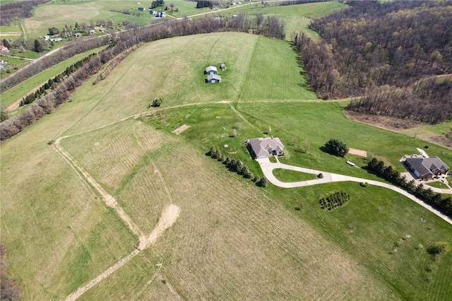 birds eye view of property featuring a rural view