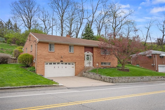 2314 Mcmonagle Ave, Banksville/Westwood, PA 15216 - raised ranch featuring driveway, a chimney, a garage, brick siding, and a front yard