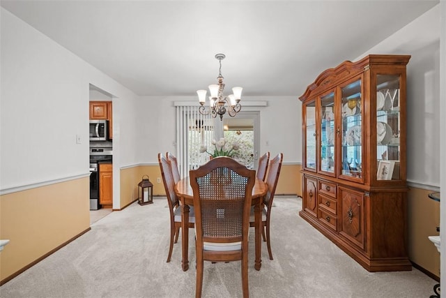 2314 Mcmonagle Ave, Banksville/Westwood, PA 15216 - dining room with light carpet and an inviting chandelier