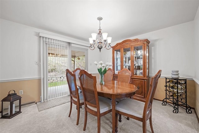 2314 Mcmonagle Ave, Banksville/Westwood, PA 15216 - dining space featuring baseboard heating, baseboards, an inviting chandelier, and light carpet