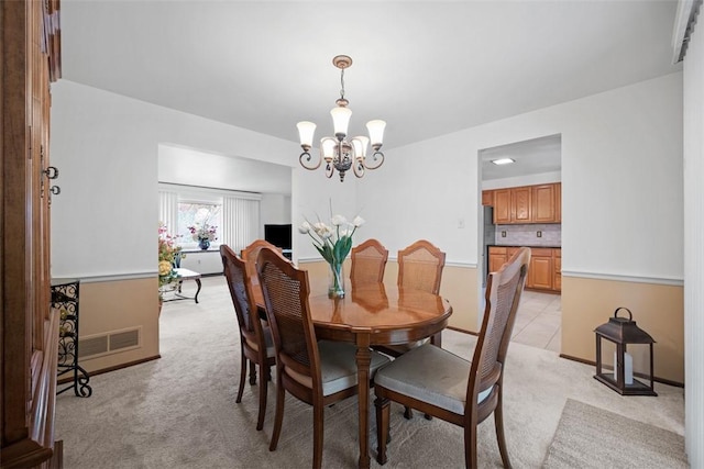 2314 Mcmonagle Ave, Banksville/Westwood, PA 15216 - dining room featuring light carpet, baseboards, visible vents, and an inviting chandelier