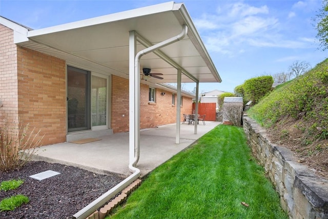 2314 Mcmonagle Ave, Banksville/Westwood, PA 15216 - rear view of property featuring fence, brick siding, a ceiling fan, a patio area, and a yard
