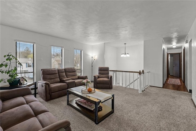 2240 Chapparal Dr, Plum Boro, PA 15239 - carpeted living room featuring a chandelier and plenty of natural light