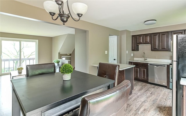 219 Parkwood Dr, Cranberry Twp, PA 16066 - dining area featuring a chandelier and light wood-style floors