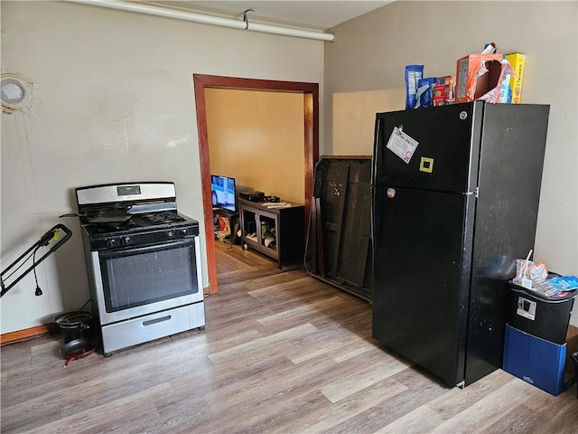113 Ohio St, Stowe Twp, PA 15136 - kitchen featuring light wood-style flooring, freestanding refrigerator, and gas range