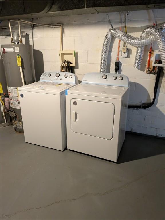 300 Thompson Ave, Clairton, PA 15025 - washroom with concrete block wall, water heater, independent washer and dryer, and laundry area