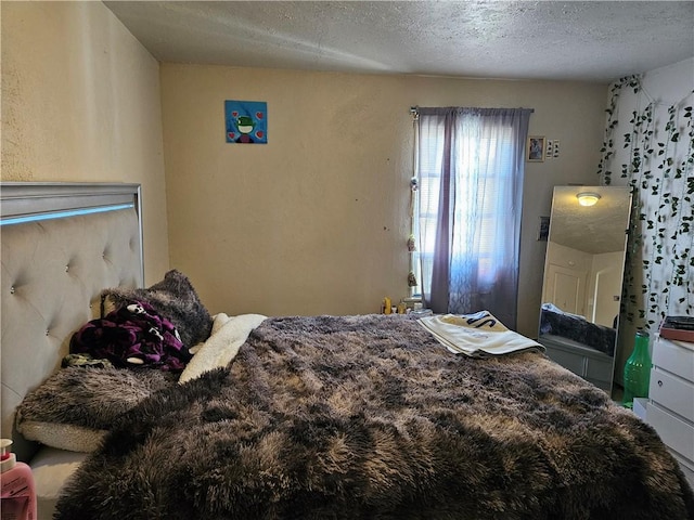 bedroom featuring a textured ceiling