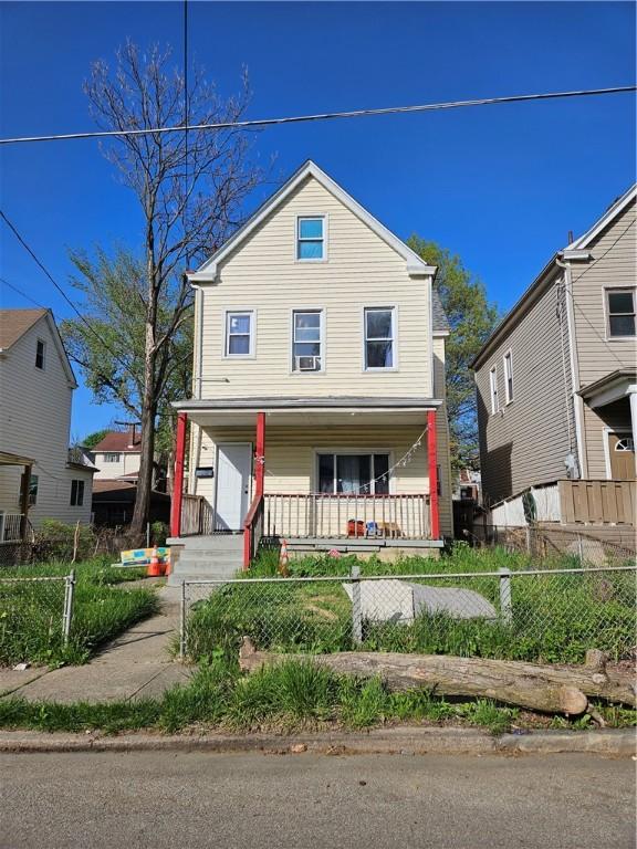 3026 Zephyr Ave, Sheraden, PA 15204 - view of front of home with a fenced front yard and covered porch
