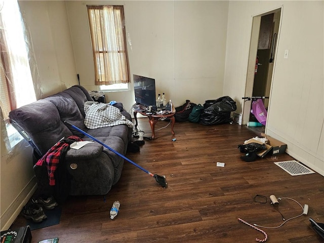 3026 Zephyr Ave, Sheraden, PA 15204 - living area featuring wood finished floors, visible vents, and baseboards