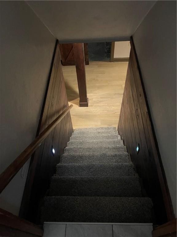 staircase with wood finished floors