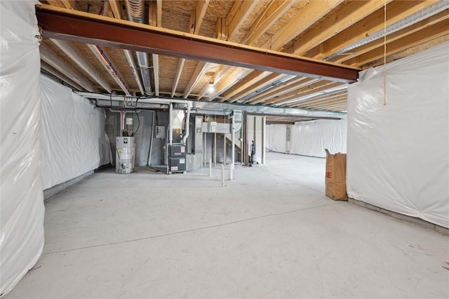unfinished basement with heating unit and gas water heater