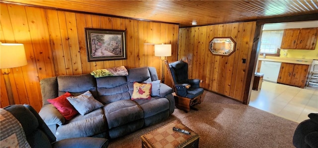 living room featuring light carpet, wooden ceiling, and wood walls