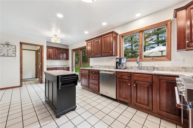 kitchen with recessed lighting, plenty of natural light, stainless steel appliances, and a sink
