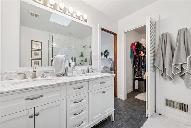 full bath with a shower stall, visible vents, and a sink