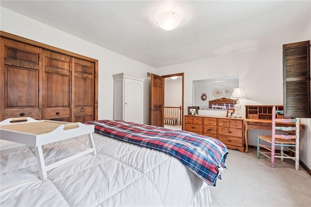 bedroom featuring light colored carpet
