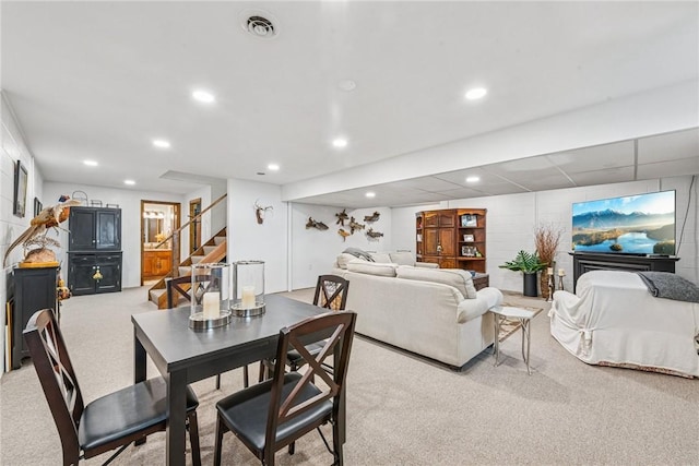 dining area featuring visible vents, light colored carpet, recessed lighting, and stairway