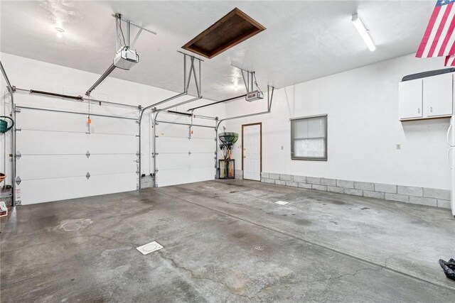 garage featuring a garage door opener