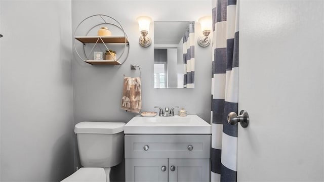 full bath with vanity and toilet