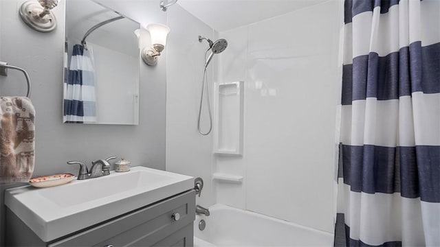 full bathroom with shower / bath combo and vanity