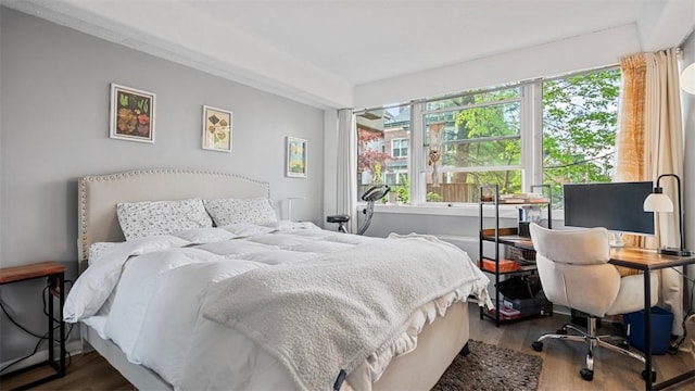 bedroom with wood finished floors