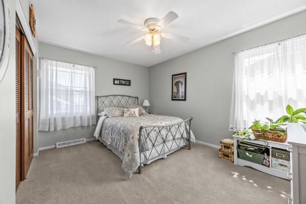 1420 Fernledge Dr, Shaler, PA 15101 - bedroom with baseboards, multiple windows, light carpet, and visible vents