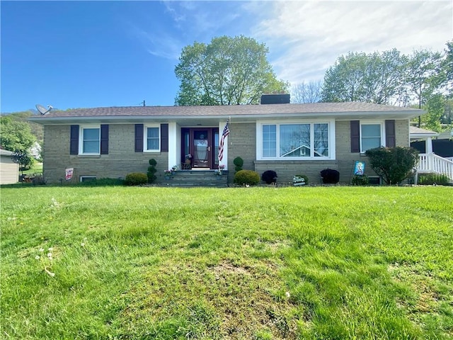 1007 Vine St, West Newton, PA 15089 - ranch-style home featuring a chimney, brick siding, and a front yard