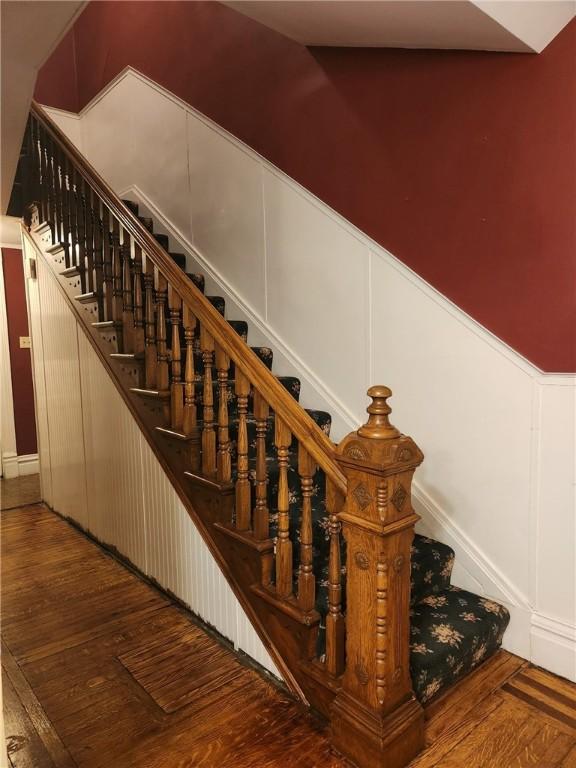 620 Main St, Latrobe, PA 15650 - staircase featuring a decorative wall and wood finished floors