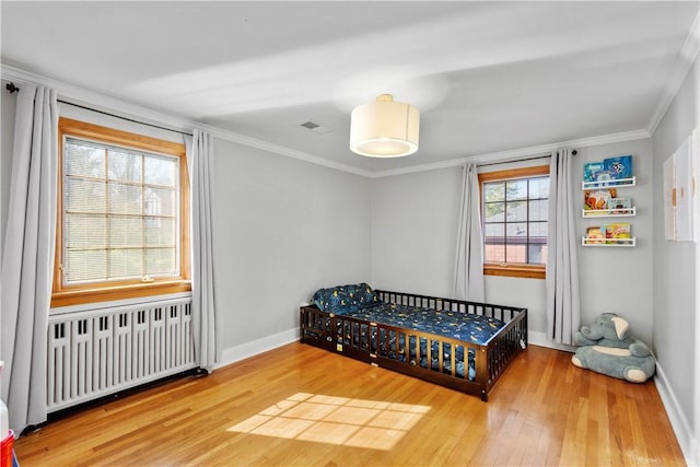 159 Inglewood Dr, Mt Lebanon, PA 15228 - bedroom with radiator heating unit, visible vents, ornamental molding, and wood finished floors