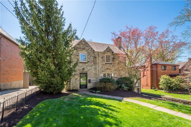 159 Inglewood Dr, Mt Lebanon, PA 15228 - view of front facade featuring a chimney, a front lawn, fence, and stone siding