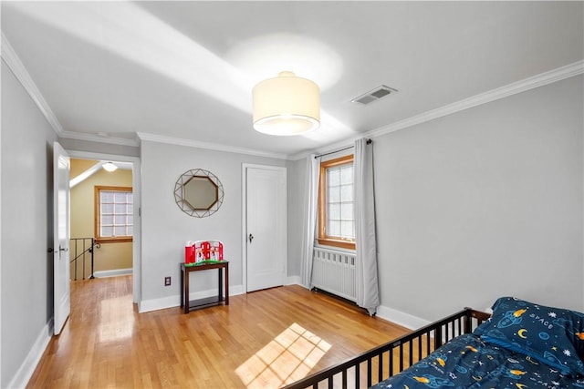 159 Inglewood Dr, Mt Lebanon, PA 15228 - bedroom featuring multiple windows, light wood-style flooring, visible vents, and radiator