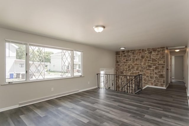 600 Indiana Ave, Monaca, PA 15061 - empty room featuring baseboard heating, baseboards, and wood finished floors