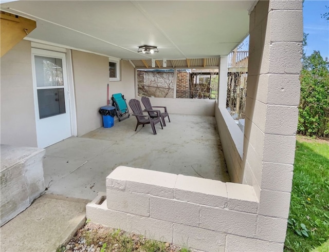 view of patio with a balcony