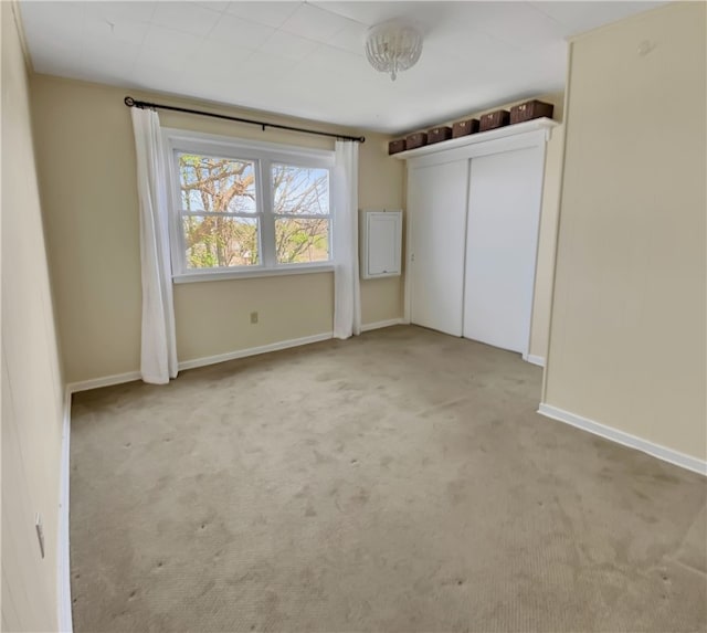 unfurnished bedroom featuring baseboards and carpet floors