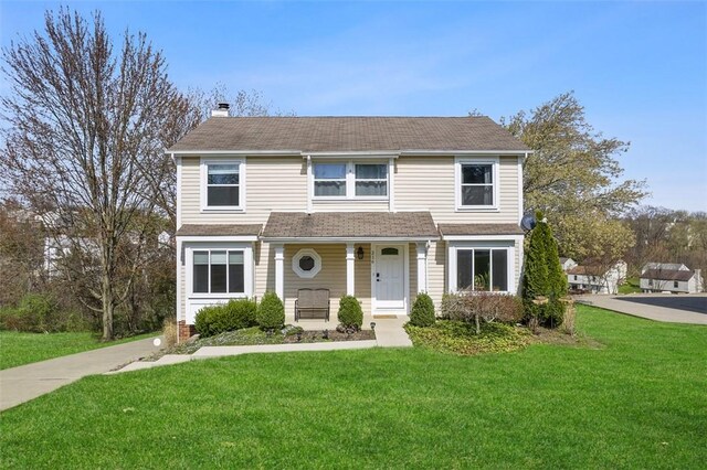 216 Briar Path, North Fayette, PA 15126 - traditional-style house featuring a chimney and a front yard
