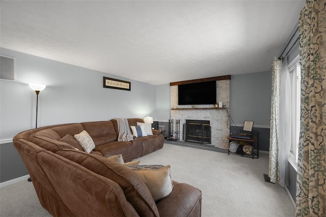 carpeted living room featuring a fireplace and baseboards