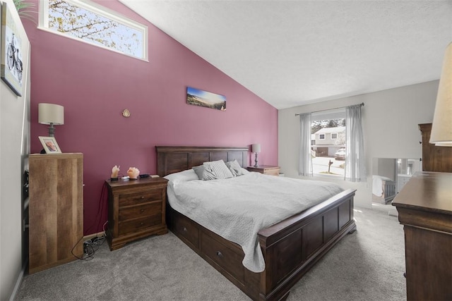 carpeted bedroom with high vaulted ceiling and baseboards