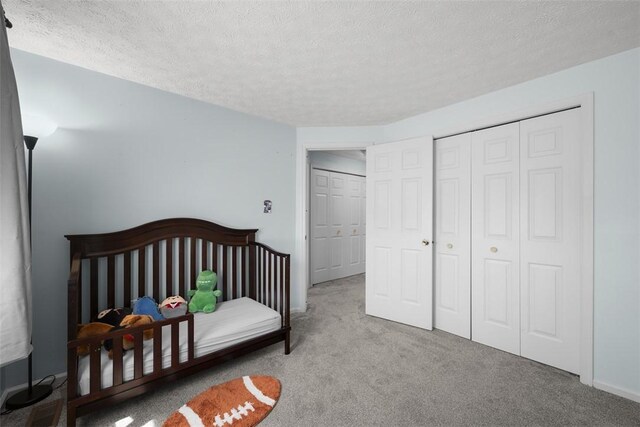 216 Briar Path, North Fayette, PA 15126 - carpeted bedroom featuring a textured ceiling and a closet