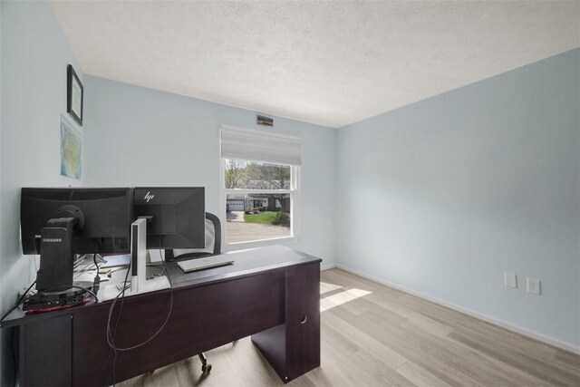 216 Briar Path, North Fayette, PA 15126 - home office featuring wood finished floors, a textured ceiling, and baseboards