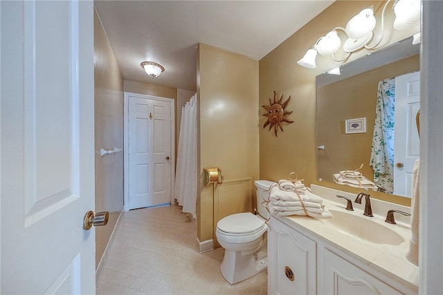full bathroom featuring tile patterned floors, toilet, vanity, and baseboards