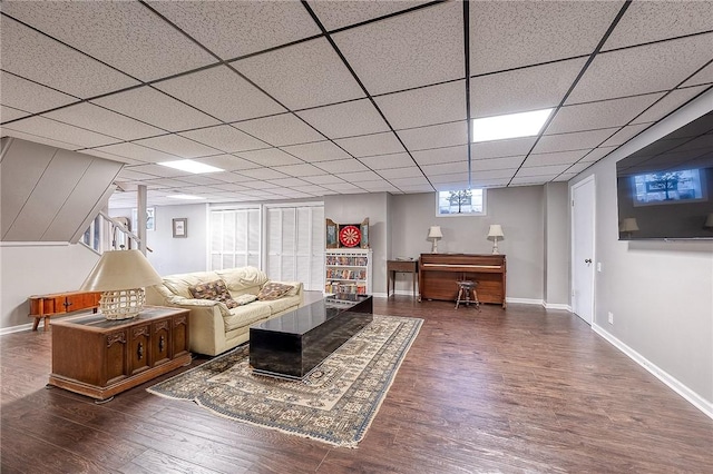 living room featuring wood finished floors and baseboards